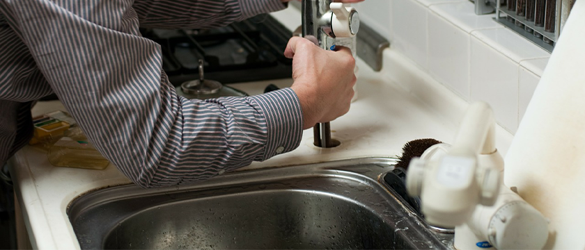 Plumber fixing Kitchen Sink Blockages